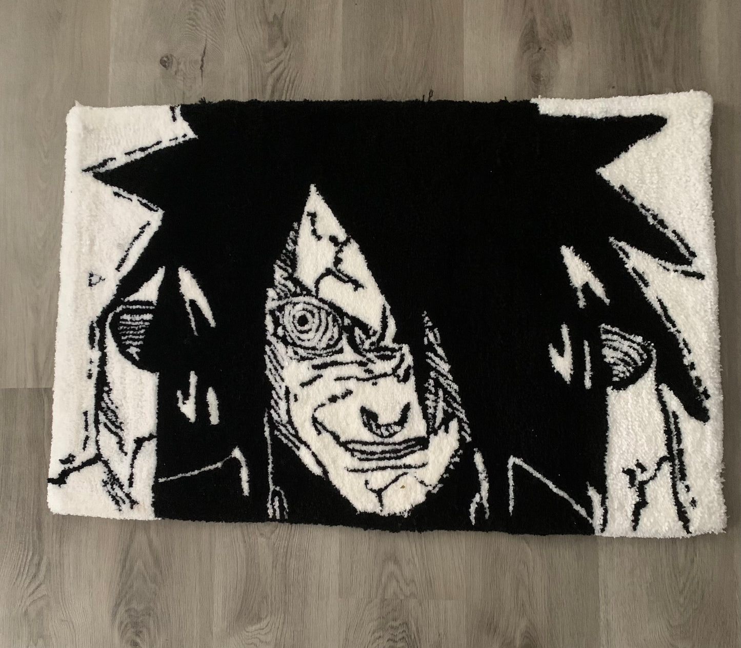 Custom-made tufted rug featuring a Naruto, Madara design. Handcrafted with love, this unique piece adds an awesome touch to any space.