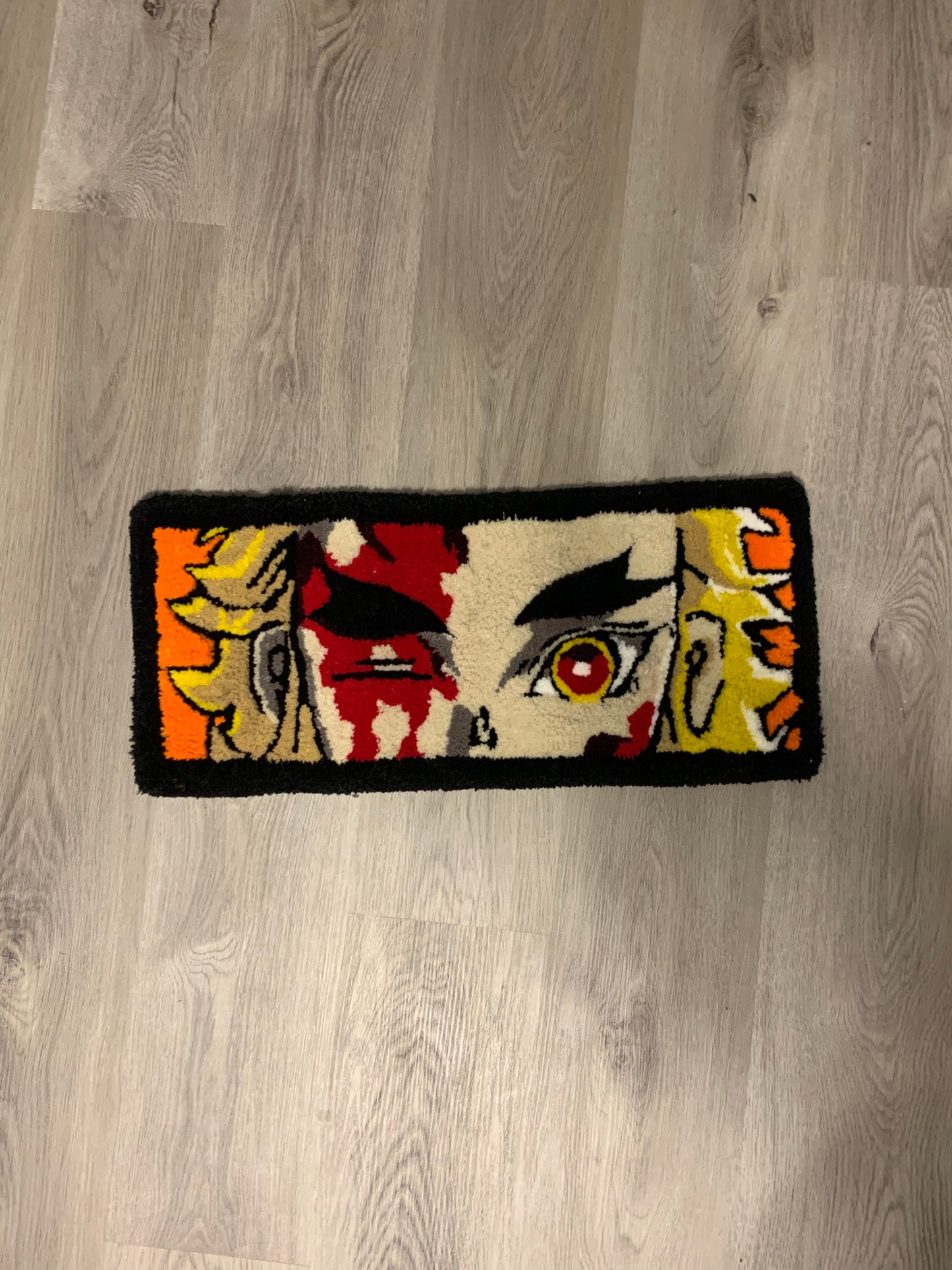 Custom-made tufted rug featuring a Demon Slayer, Rengoku design. Handcrafted with love, this unique piece adds an awesome touch to any space.